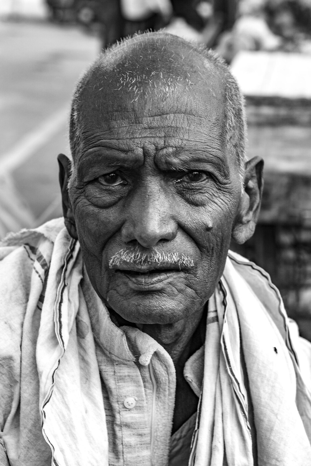 Portrait of an elderly man with a weathered face