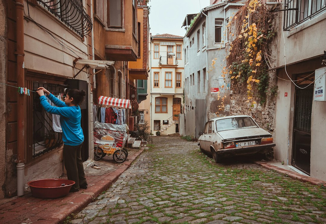 Photographer taking pictures in an old town street