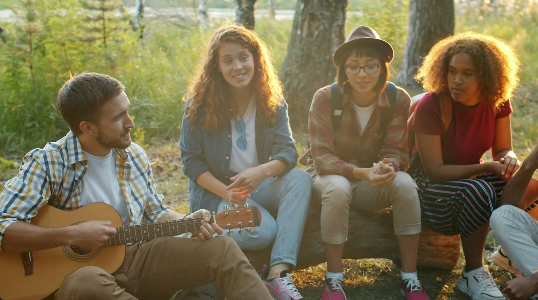 Group of friends gathered together outdoors
