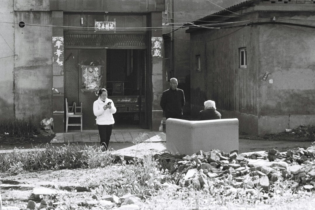 elderly men talking in village