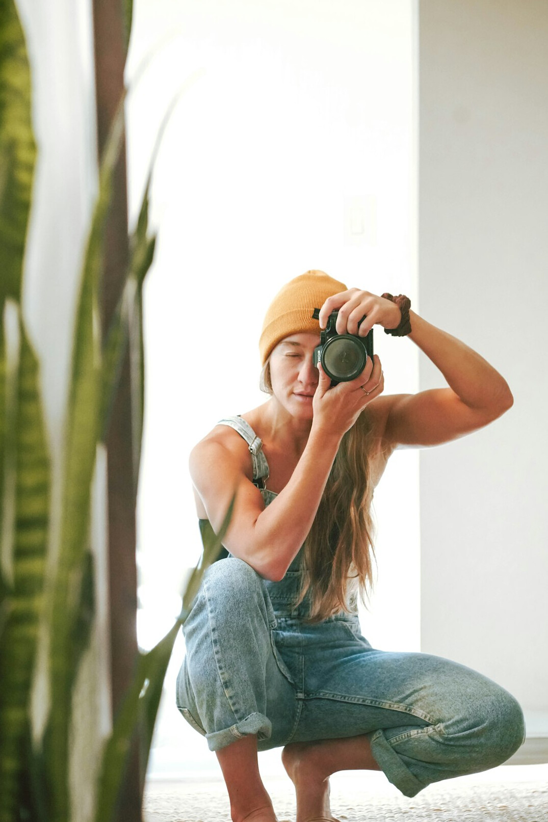 Portrait of a woman photographer holding a camera